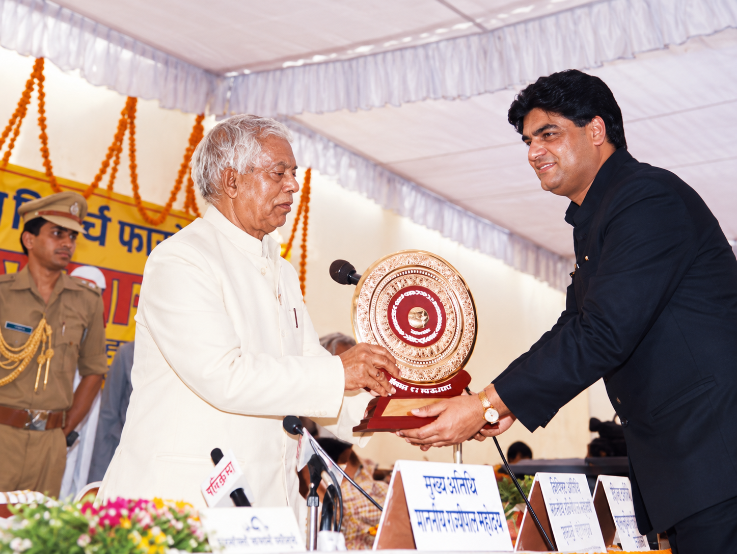 Dr. R.K. Gupta receiving an award from Shri Suraj Bhan, then Governor of Uttar Pradesh.